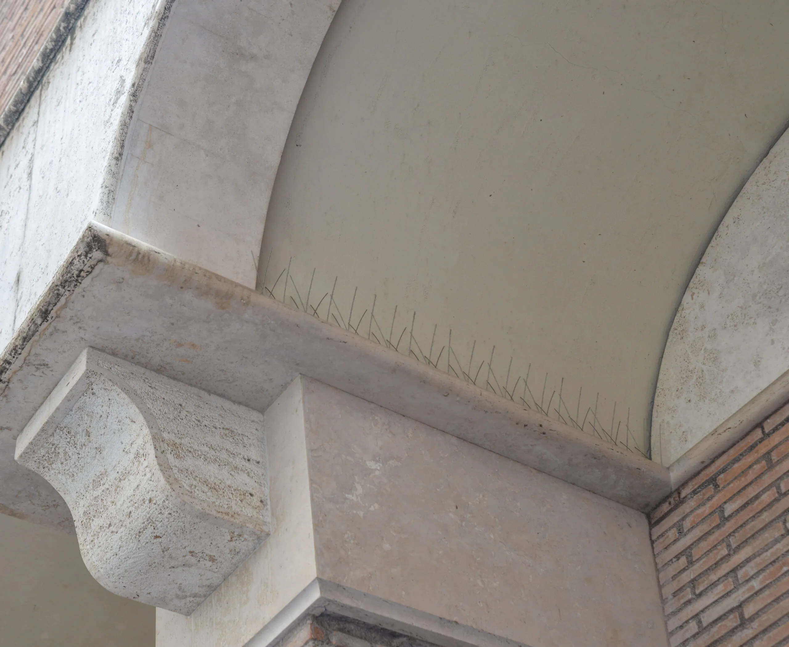 A close up of a building with a brick wall.